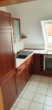 Küche - Dachgeschosswohnung mit Einbauküche und Balkon